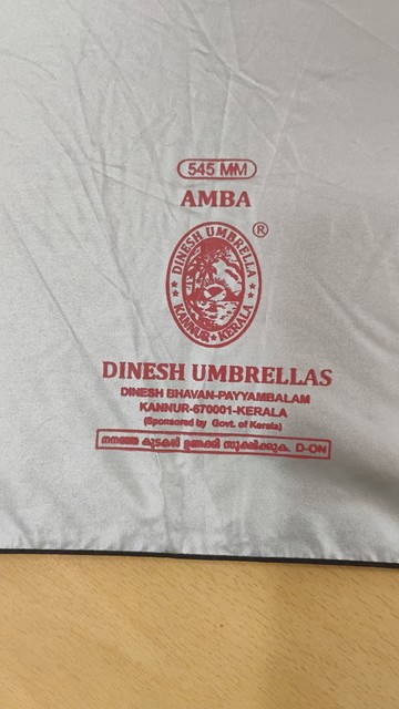 Stamp inside umbrella cloth. "Dinesh umbrellas", made in Kannur, Kerala