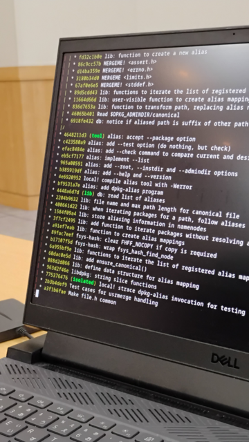 A laptop screen with git history