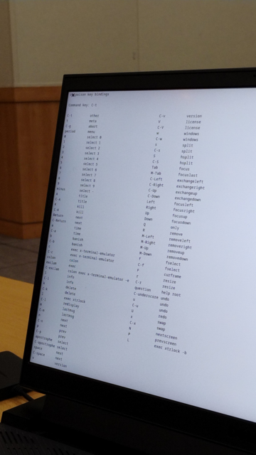 A laptop screen showing the keyboard shortcuts of ratpoison WM (X11)