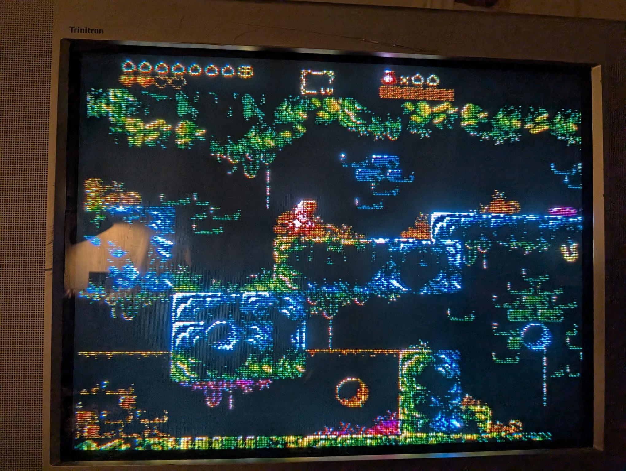 photo of a colorful, 8 bit platformer game on a CRT photo of a colorful, 8 bit platformer game on a CRT