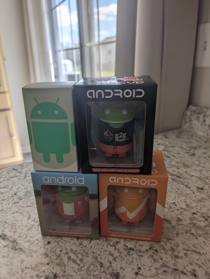 A photo of 4 Android mini figurines that I purchased.
