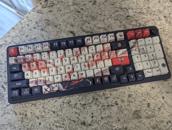 A photo I took of the Redragon Eisa K686 Pro SE keyboard showing off the anime design on the keyboard itself.