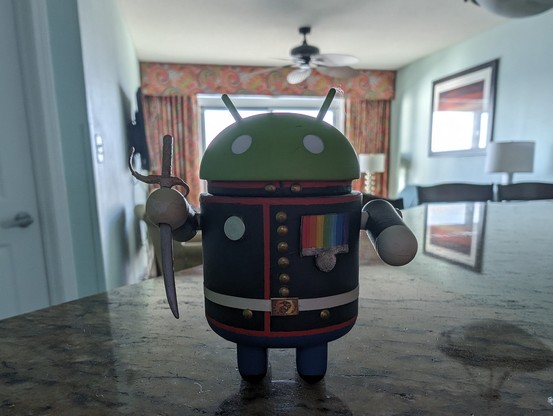 A photo of the Marine Corps custom Android mini figurine that I had made for my dad 12 - 13 years ago. 