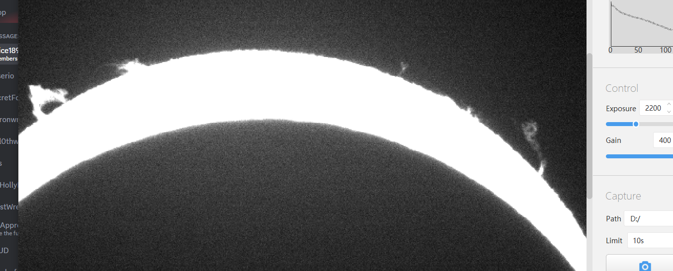 Screenshot of prominences on the sun during the eclipse.  One makes a giant loop, and one makes a tornado shape