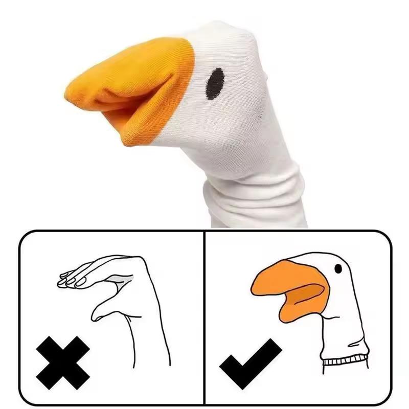 goose sock puppet on hand with a handy instructional diagram: naked hand no, sock puppet hand yes