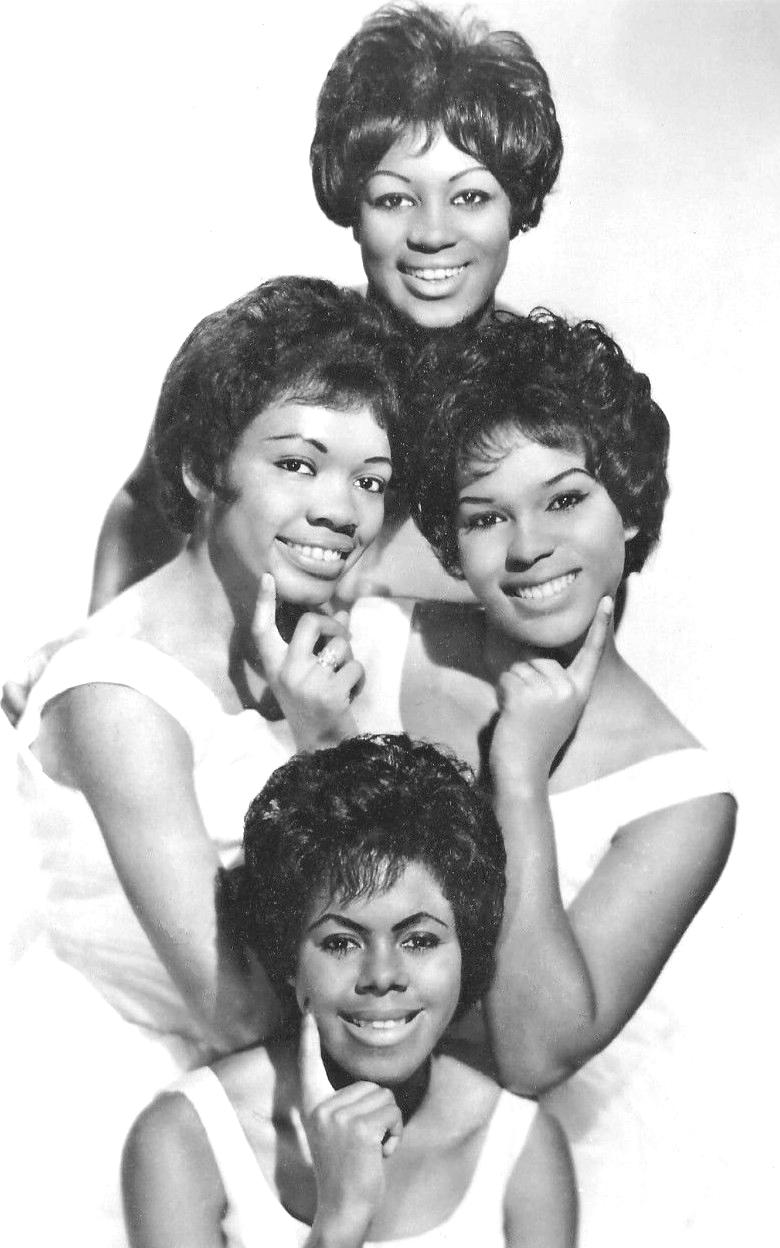 Publicity photo of The Shirelles. Clockwise from left: Doris Coley, Addie "Micki" Harris (top), Shirley Owens, and Beverly Lee. They are all wearing 1960s era hairstyles and light-colored dresses with wide shoulder straps. (1962, Black and white)