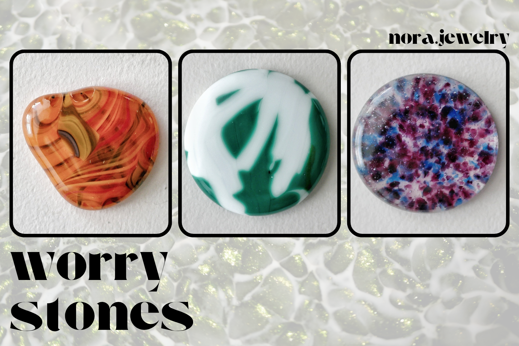 worry stone collection: this one has an orange collage design worry stone in an abstract shape, a white and green one where the edges between the colors blur, and a round one in a bi pride pattern.