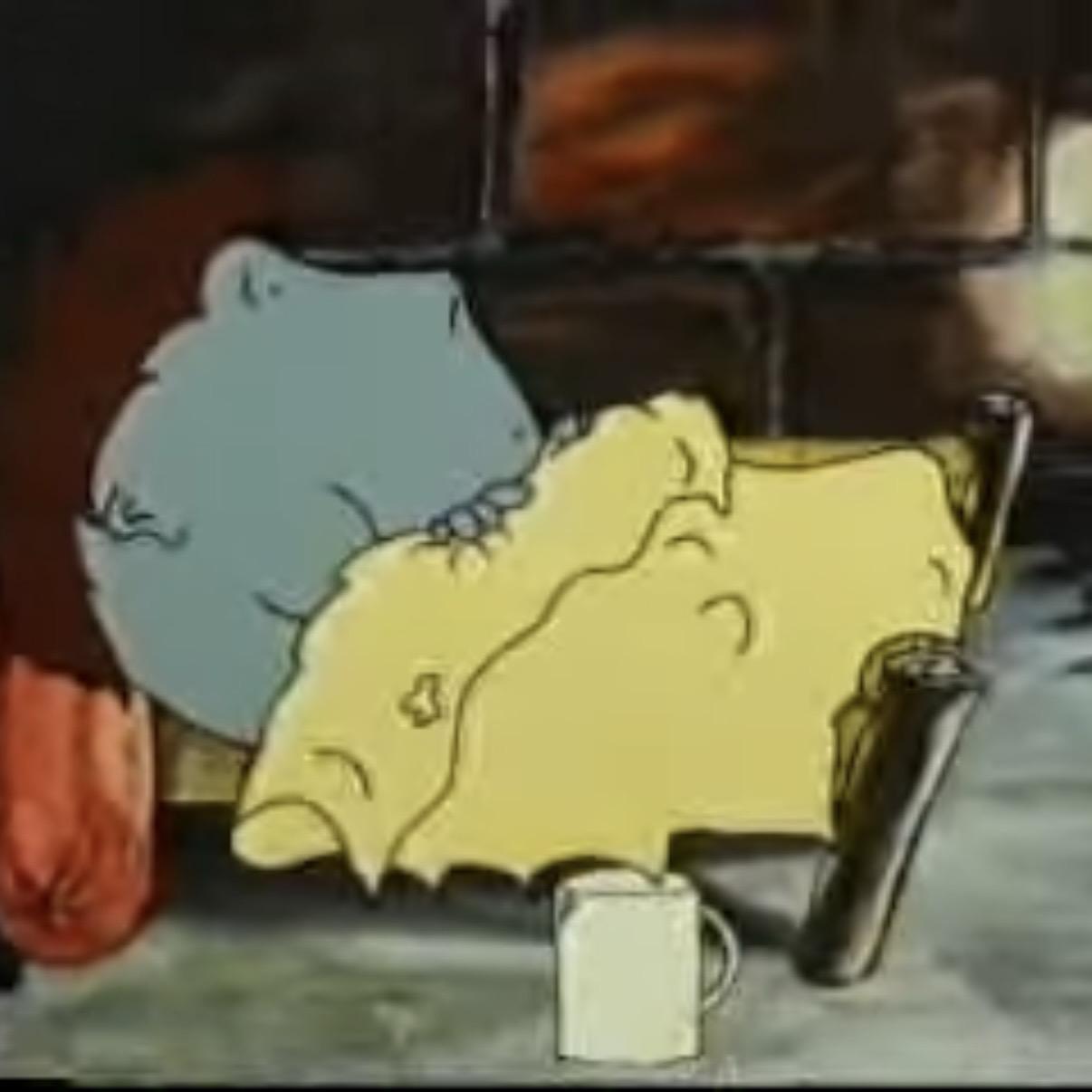 Screenshot of Murun Buchstansangur in his bed under a yellow rag of a sheet. There is a coffee cup beside his bed