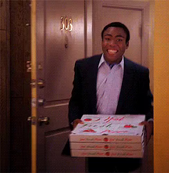 Troy (Donald Glover) from Community walks in with pizza, smiling

he is confronted by the entire room on fire, with flaming pants(?) being swung around. He looks horrified.