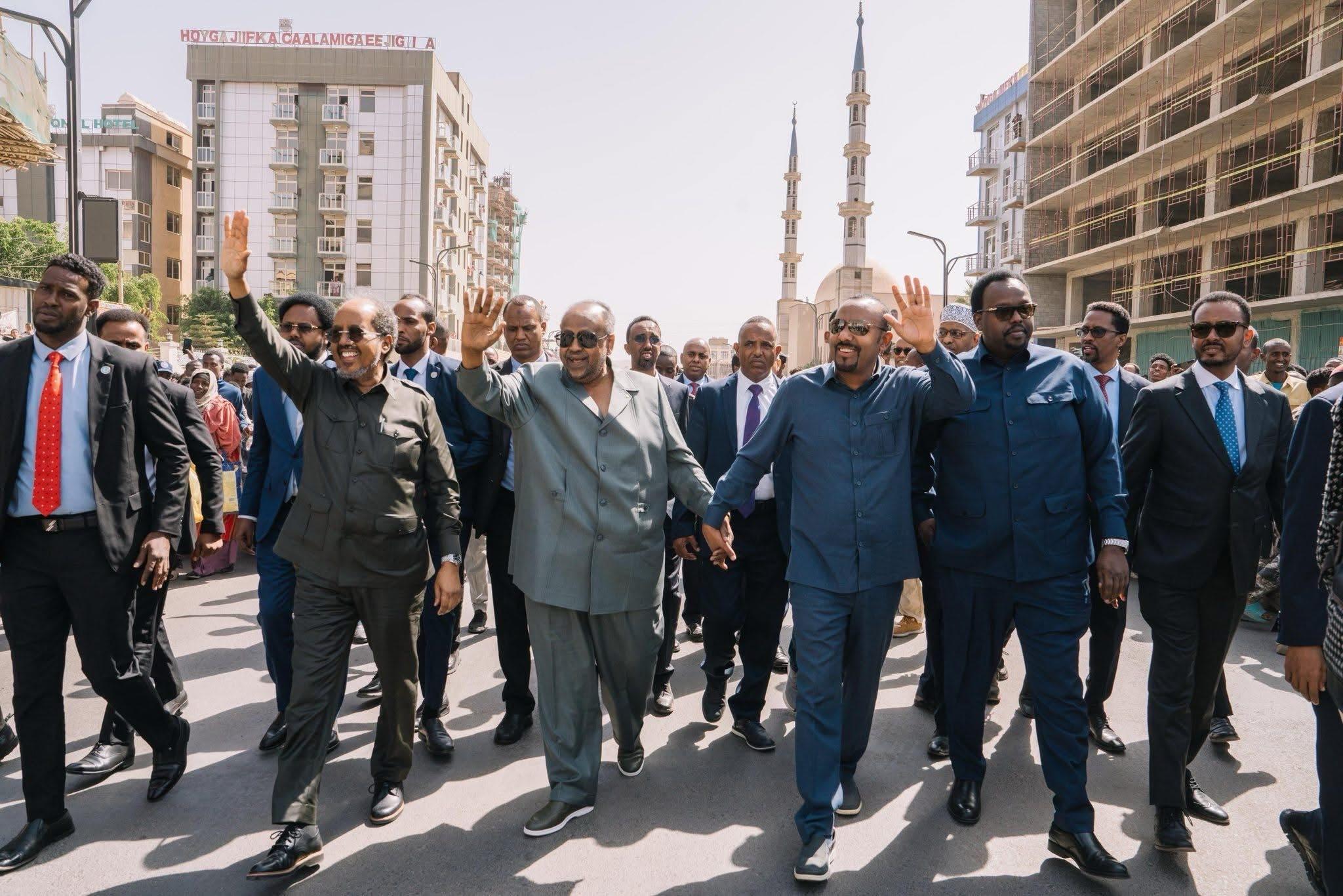 Leaders of Ethiopia, Somalia and Djibouti accompanied by security officials walking the streets of Jijiga, Somali State