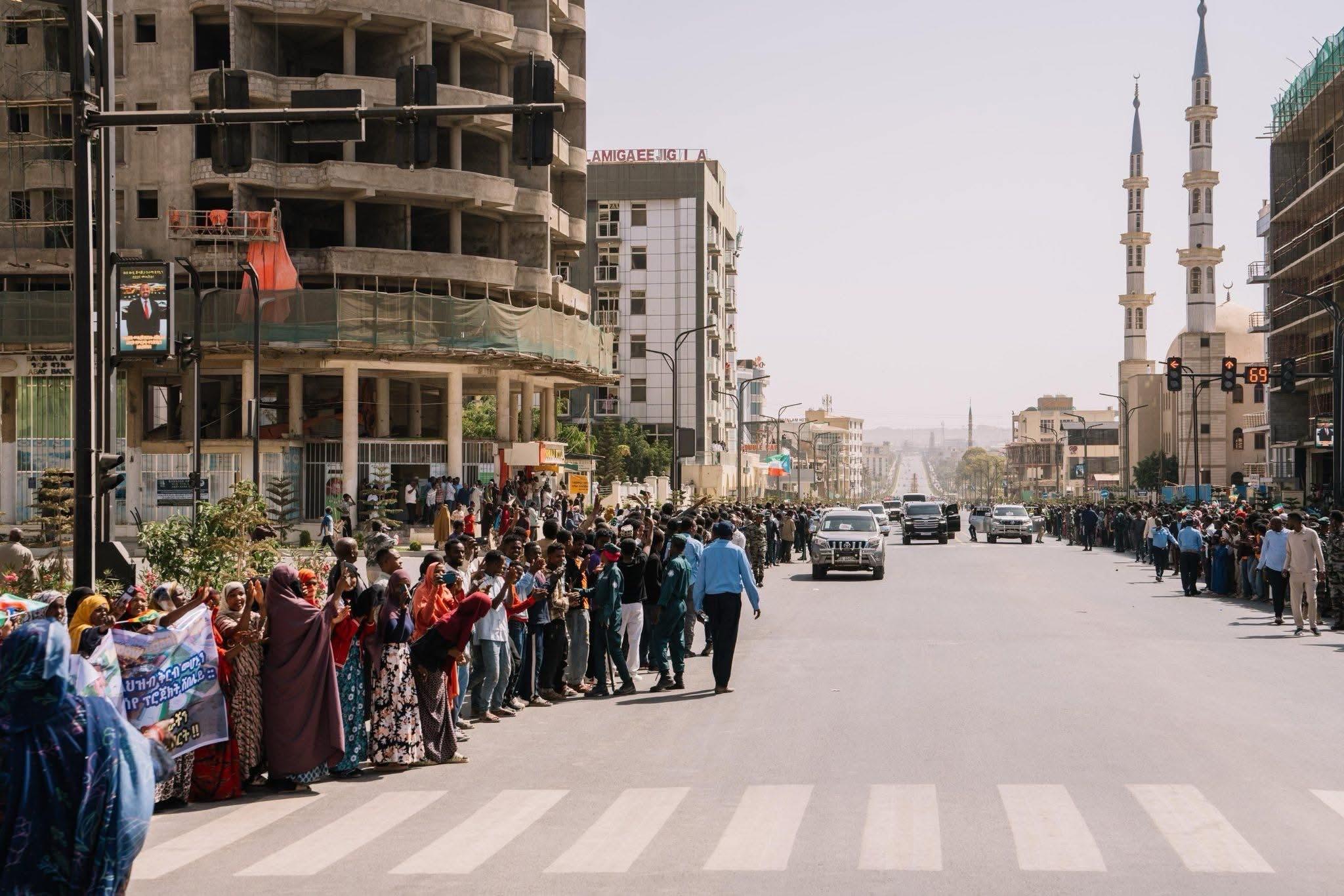 Leaders of Ethiopia, Somalia and Djibouti accompanied by security officials walking the streets of Jijiga, Somali State
