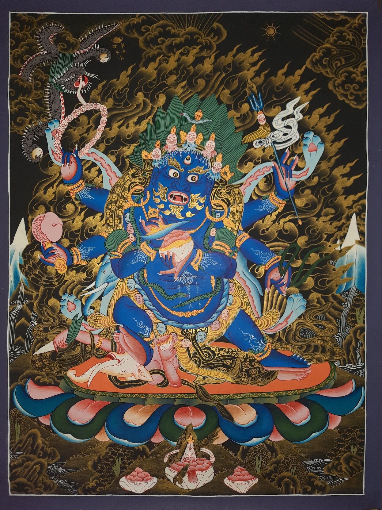 mahkala deity Tibetan The deity is depicted in the iconography with three eyes over his face with one on his forehead, which represents the past, present, and future, showing the comprehension of time. The five skulls that make up the crown on his head <br />stand in for the five deadly delusions of anger, want, ignorance, envy, and pride. In the end, these illusions become the pearls of wisdom of the five Buddha families.