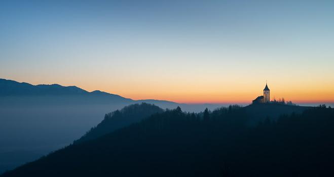 Sunrise at the Church of St. Primus and Felician in Slovenia. And a bit of a scrum it was too - over 20 photographers landed simultaneously on a short stretch of road, set up their tripods, snapped furiously for 20 minutes, and then fled the scene. Kind of takes some of the magic out of these moments. But it was still magical.