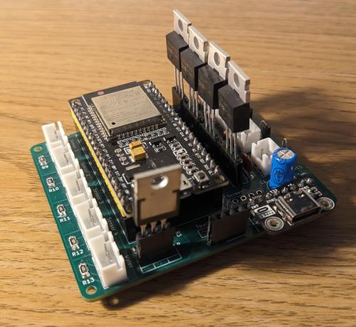 Photo of a PCB with a microcontroller and various components