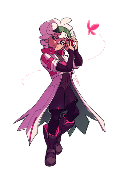 Bede is in his syga suit and protectively holding on to a regular pokeball. A bright pink butterfly is circling around him.