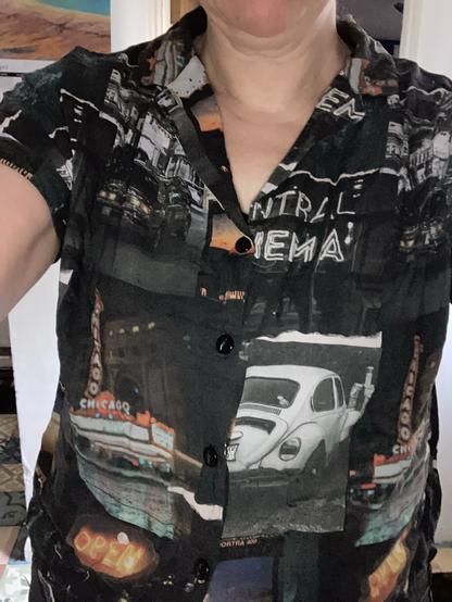 Close-up of the fabric - mainly black and white photography with orange bits, neon signs and old cars