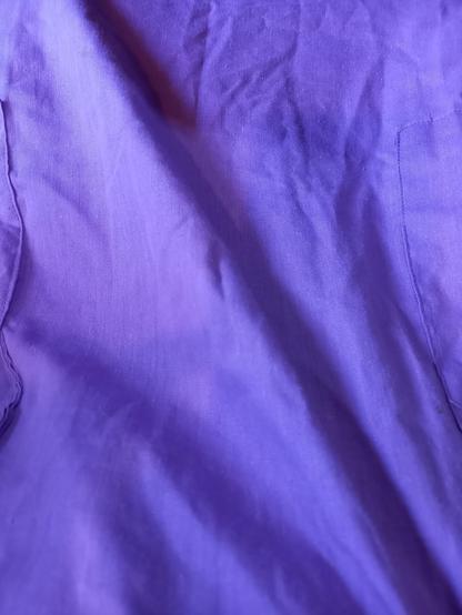 Photo shows the skirt of the dress I'm wearing, to show the lilac purple colour which is mostly accurate.