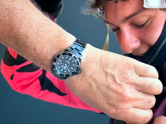 Kimi and a black Rolex.