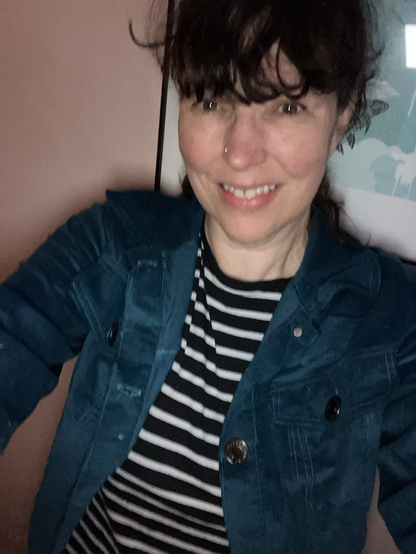 A middle aged woman wearing the aforementioned jacket