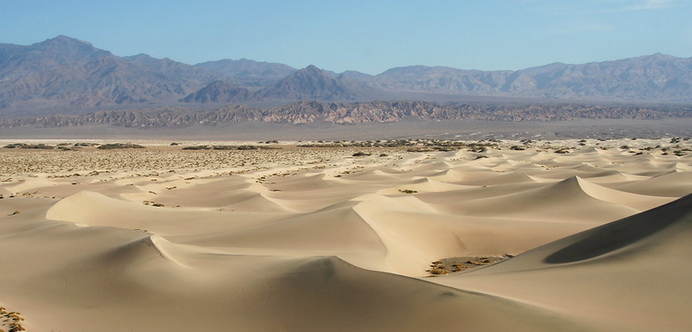 Same sand dunes, mountains in the background, different view