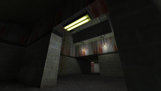 In this picture you can see that you are in a room to the left of the second entrance. From left to right you can see a wall, a passageway where a yellow illuminated lamp is attached to this above, another room where a yellow ladder leads up to the left and two illuminated light bulbs in the other room this hang from the ceiling, as well as a hallway, which leads to the left into another room and also at the top of the passage a yellow illuminated lamp is attached. This is on the map de_nuke in the game Counter-Strike 1.6.