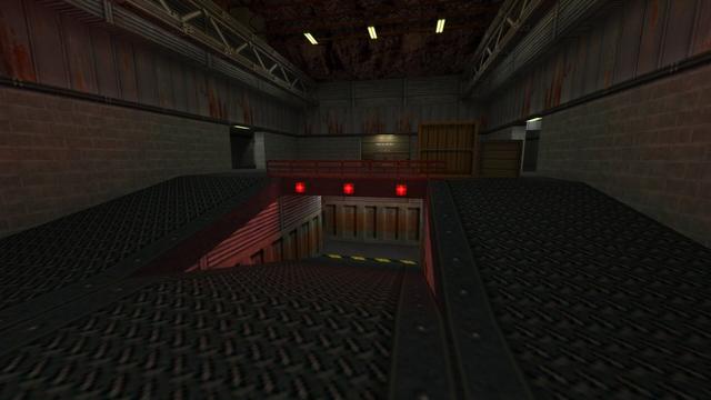 In this picture you can see the room in which the hallway from the previous picture led. From left to right you can see an entrance/exit, a dark gray metal gate, a large and small wooden box standing next to each other and another entrance/exit. You can see in the foreground that a ramp leads down. Two left and right which leads from the height of the entrances / exits a little down to one between platform and then after times in the middle further down. Above the middle ramp are three red-lit square lamps. Furthermore, the entrances / outputs and also the ceiling have illuminated lamps. Steel girders can also be seen on the ceiling on the left and right. This is on the map de_nuke in the game Counter-Strike 1.6.