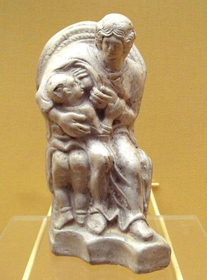 Statue of the mother goddess Matrona (Gaulish equivalent of Modron) breastfeeding her son. Found in France.