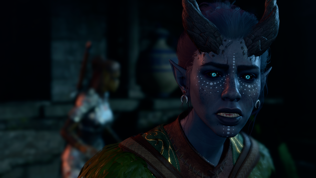 Astrea, a grey-blue tiefling, looks in horror at something off-screen. Lae'zel is moving into battle stance in the background.