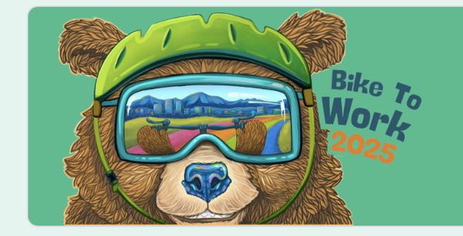 Head of a Bear in green bike helmet wearing goggles that reflect Alaskan landscape of peaks beyond fields.  Bike to Work 2025