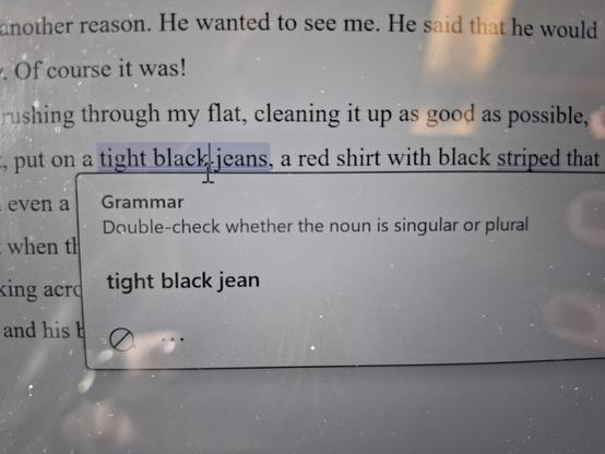 A text block in a writing program marked the phrase "tight black jeans" and suggests to check if it's singular, meaning "tight black jean"