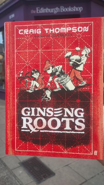 A copy of graphic memoir Ginseng Roots by Craig Thompson, outside the Edinburgh Bookshop
