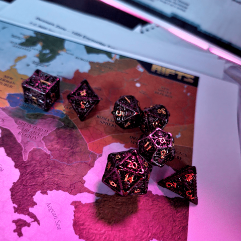 A full set of polymerase rpg dice lying on a map of a post apocalyptic Europe.