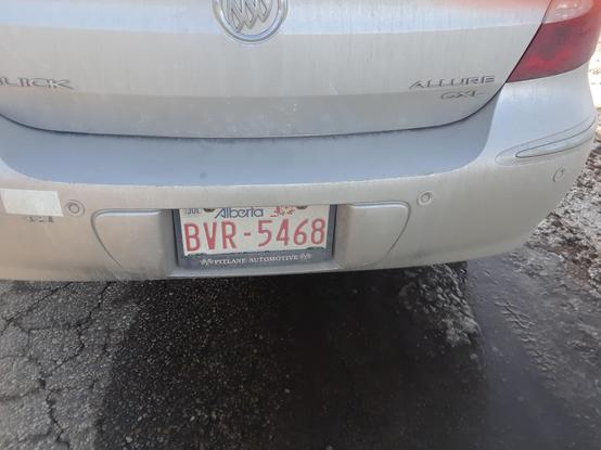Alberta License plate with the numbers BVR-5468. The vehicle was parked along several others pushing Separatist agenda.