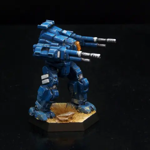 A painted miniature of a Rifleman 'Mech.  It is blue with white highlights.  The cockpit glass is orange.  The emblem of the 1st Aragon Borderers, a blue crenelated shield, is on the right leg.