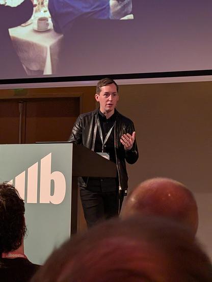 Paris Marx giving the closing keynote on reclaiming digital sovereignty at Boosterconf