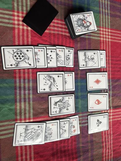 Selfmade Set of playing Cards, Late on the Table like a Game of Solitaire