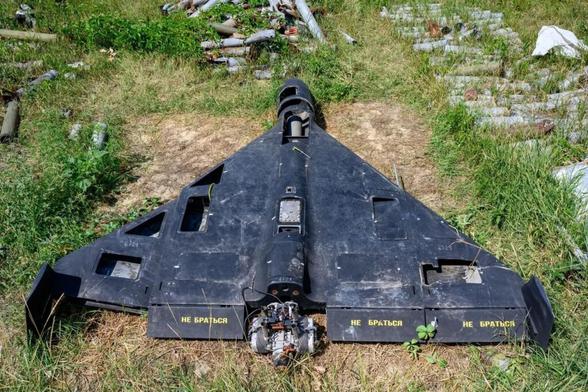The remains of a Russian-made, Iran-designed Shahed-136 drone, known as a Geran-2 in Russia, sit among a collection of Russian drones, glide bombs, missiles, and rockets launched at Ukraine, maintained as evidence for eventual war crimes prosecutions against Russia, summer 2025, in Kharkiv, Ukraine