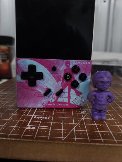 A gamedad printed with the cover of The Mysterious Air Pirates in pink and blue.