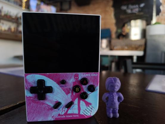 The same game dad, with a filibux keshi standing next to it.