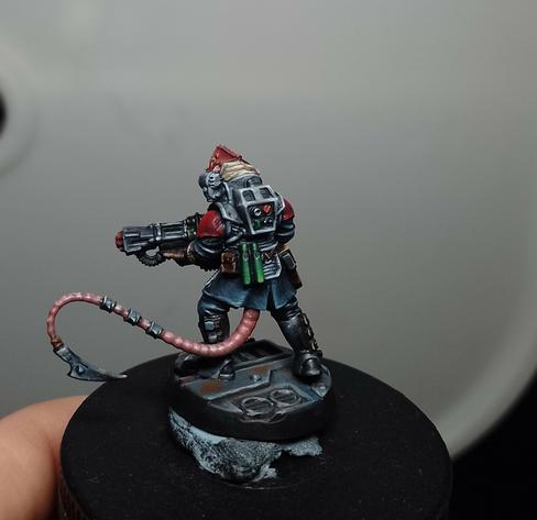 Miniature of a humanoid rat clutching a big gun