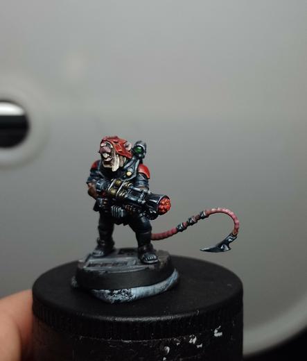 Miniature of a humanoid rat clutching a big gun