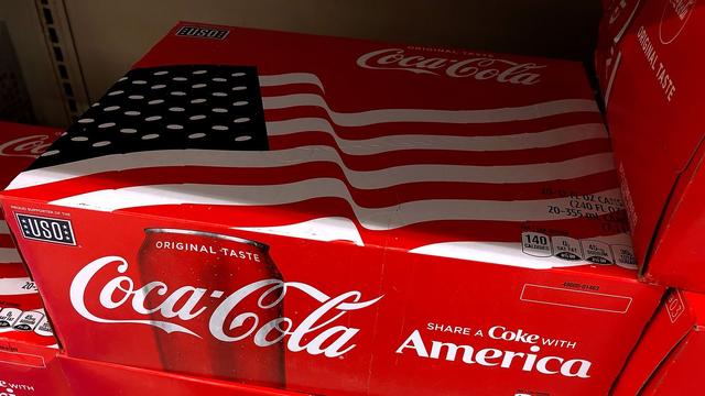 A case of Coca-Cola with an American flag image on top.