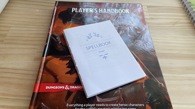 Spellbook text block stitched together on top of Players Handbook