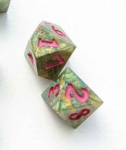 A close up of a couple of the inked dice