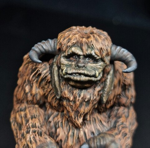 Model of ludo from the labyrinth painted very realistically, browny orange fur with horns and leather skin