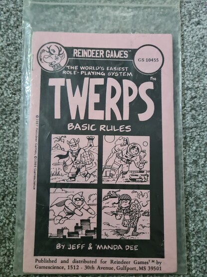 A photo of the basic rules for TWERPS in it's plastic bag