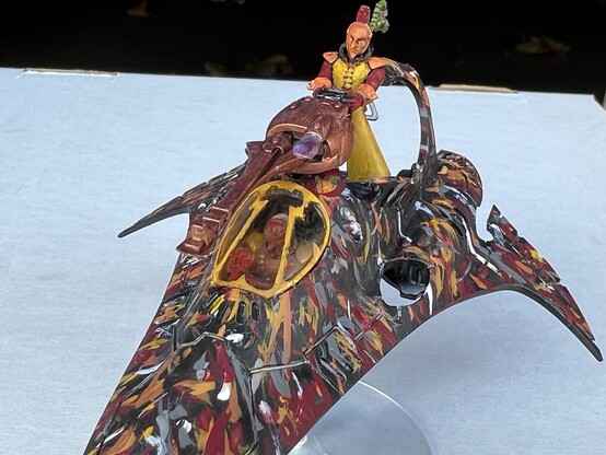 Warhammer 40K model

Harlequin Starweaver Transport

Close up view to see the red and orange pilot in the cockpit. 
