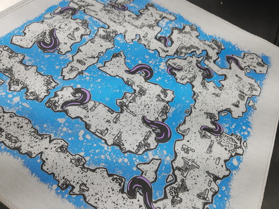 A screen printed cloth map featuring grey rubble stone, blue bubbling water, and tentacles with purple sheen rising from the depths