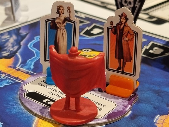 The mini fig of Dracula sharing the same location as our two player markers. Rather looks like he is flashing the two female characters. 