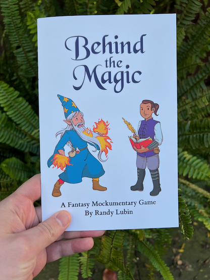 a printed copy of Behind the Magic